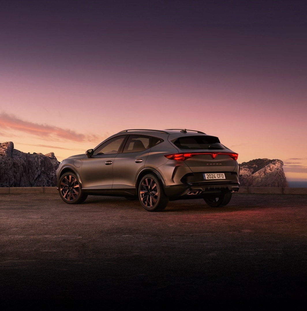 new cupra formentor offer, suv in century bronze matt, model year 2025, with 19 inch artic copper wheels and cityscape background. New car offers available.