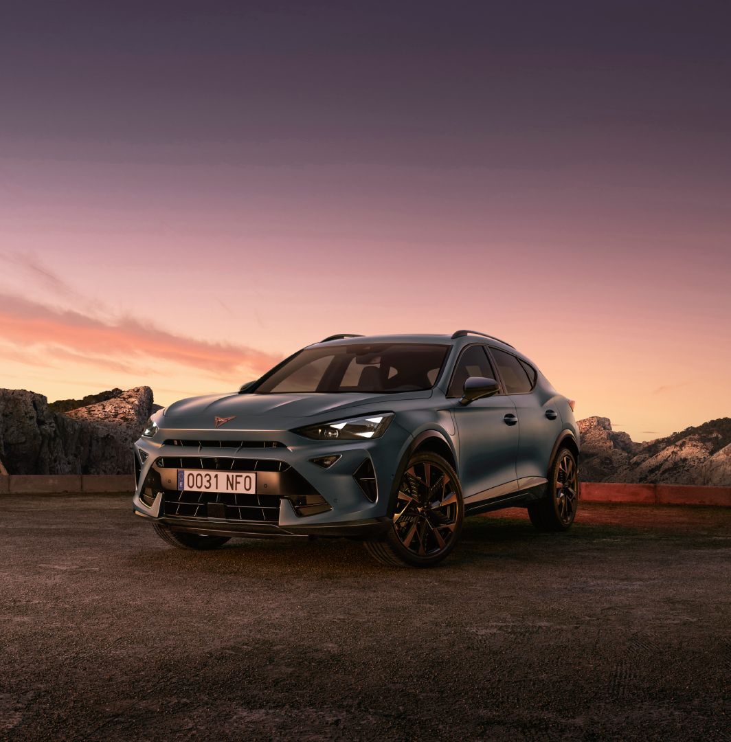 new cupra formentor offer, suv in century bronze matt, model year 2025, with 19 inch artic copper wheels and cityscape background. New car offers available.