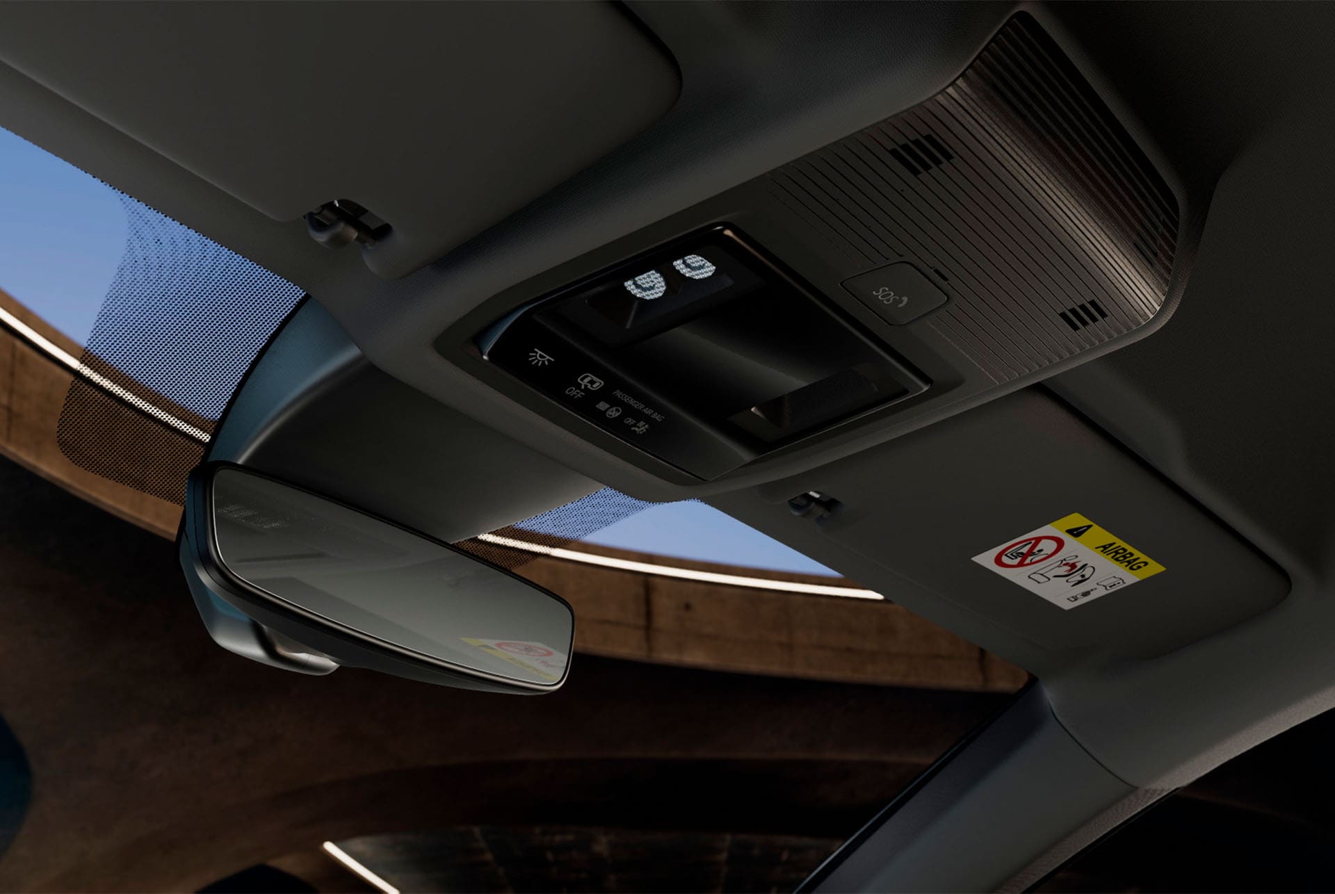 Vista interior del nuevo CUPRA Formentor 2025, donde se ve la consola superior con espejo retrovisor, luces LED del habitáculo, diversos mandos y funciones de conectividad CUPRA, incluido un botón de emergencia SOS.