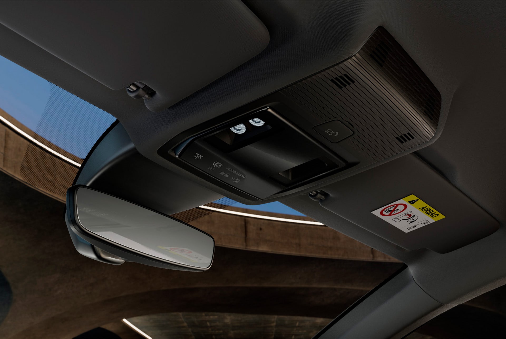 Vista interior del nuevo CUPRA León Sportstourer 2025, donde se ve la consola superior con espejo retrovisor, luces LED del habitáculo, diversos mandos y funciones de conectividad CUPRA, incluido un botón de emergencia SOS.