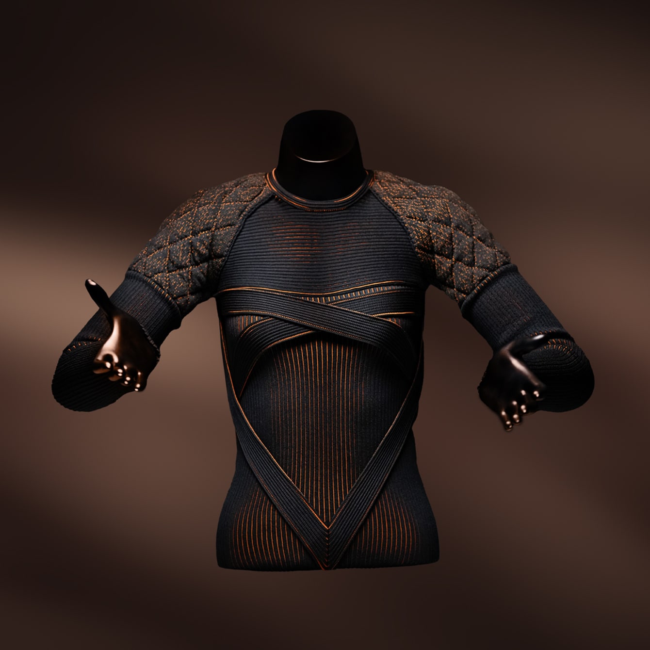 Top de moda texturizado con paneles acolchados marrones y detalles naranjas sobre maniquí negro con fondo oscuro, sobre una superficie blanca.