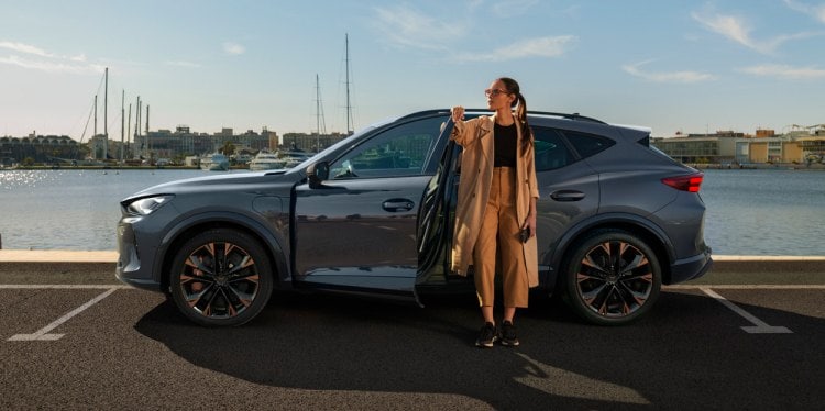 Woman exiting the cupra tavascan obtained through classical credit leasing with no balloon payment. Woman exiting the cupra tavascan obtained through classical credit leasing with no balloon payment.