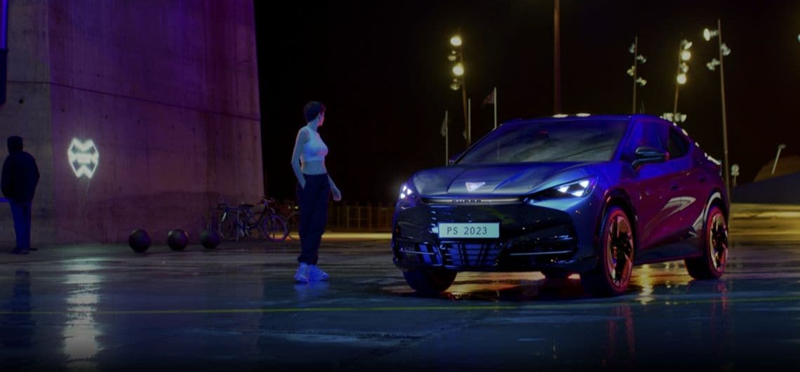 alexia putellas sitting in front of black cupra formentor vehicle